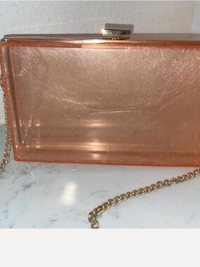 Peach Rose Gold Resin Clutch Handbag with a Gold Long Chain and Frame